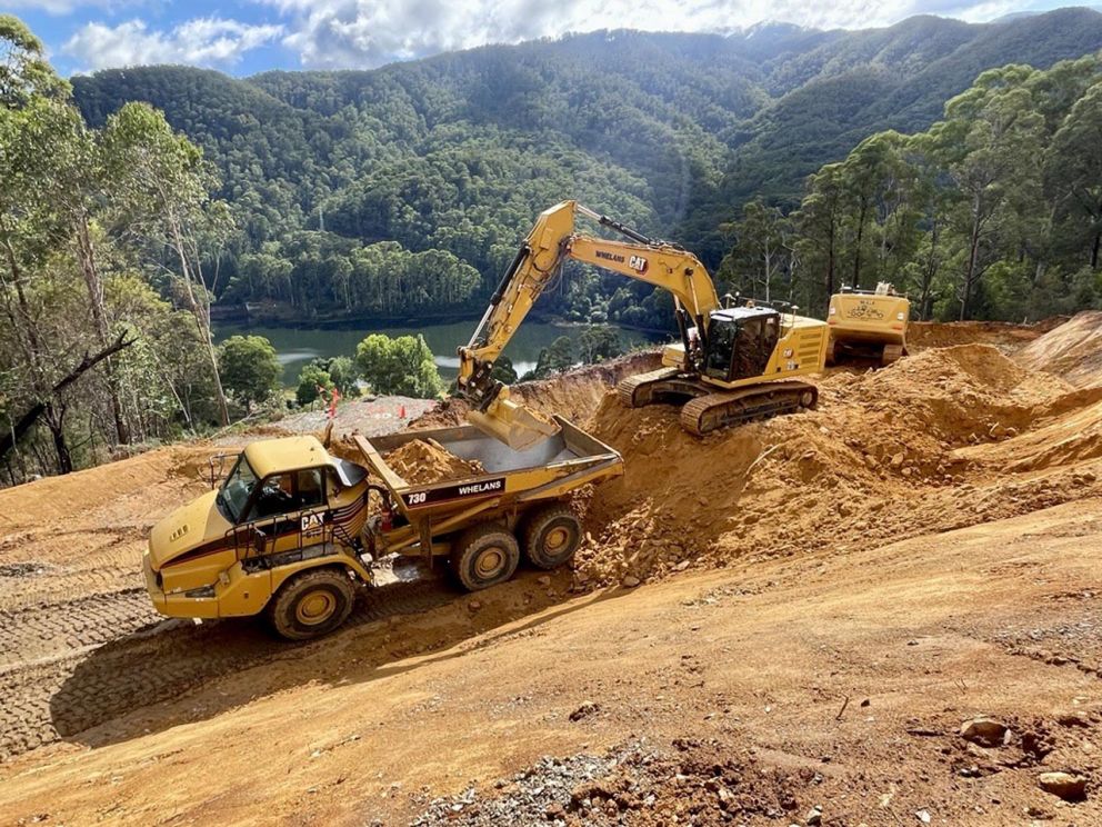 Excavator loads material into a truck on the landslip 7 March