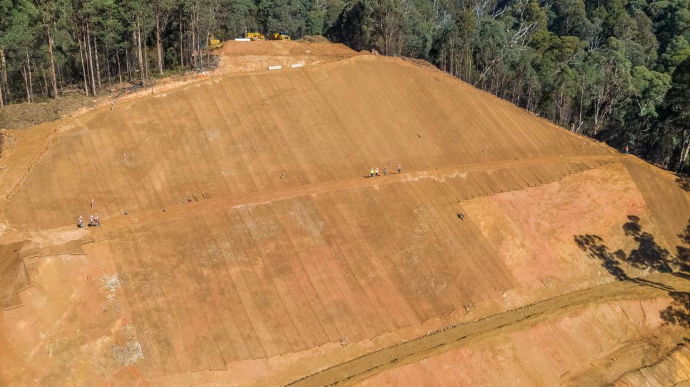 Crews working on upper benches of the Bogong High Plains Rd landslip