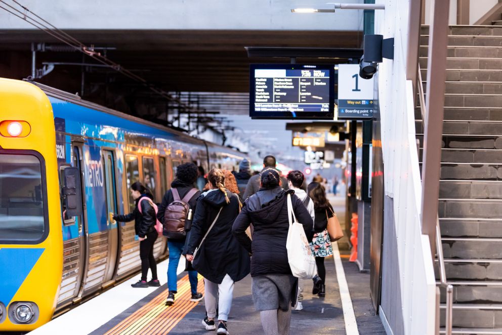 Passengers boarding the first trains to stop at the new Glen Huntly Station