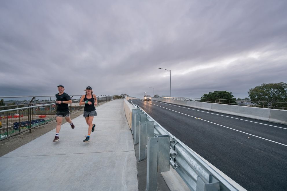 A pair of runners cross the new Brunt Road bridge in record time