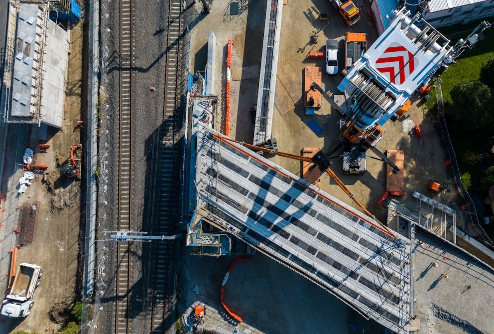 A view directly above the crane while lifting the bridge beam