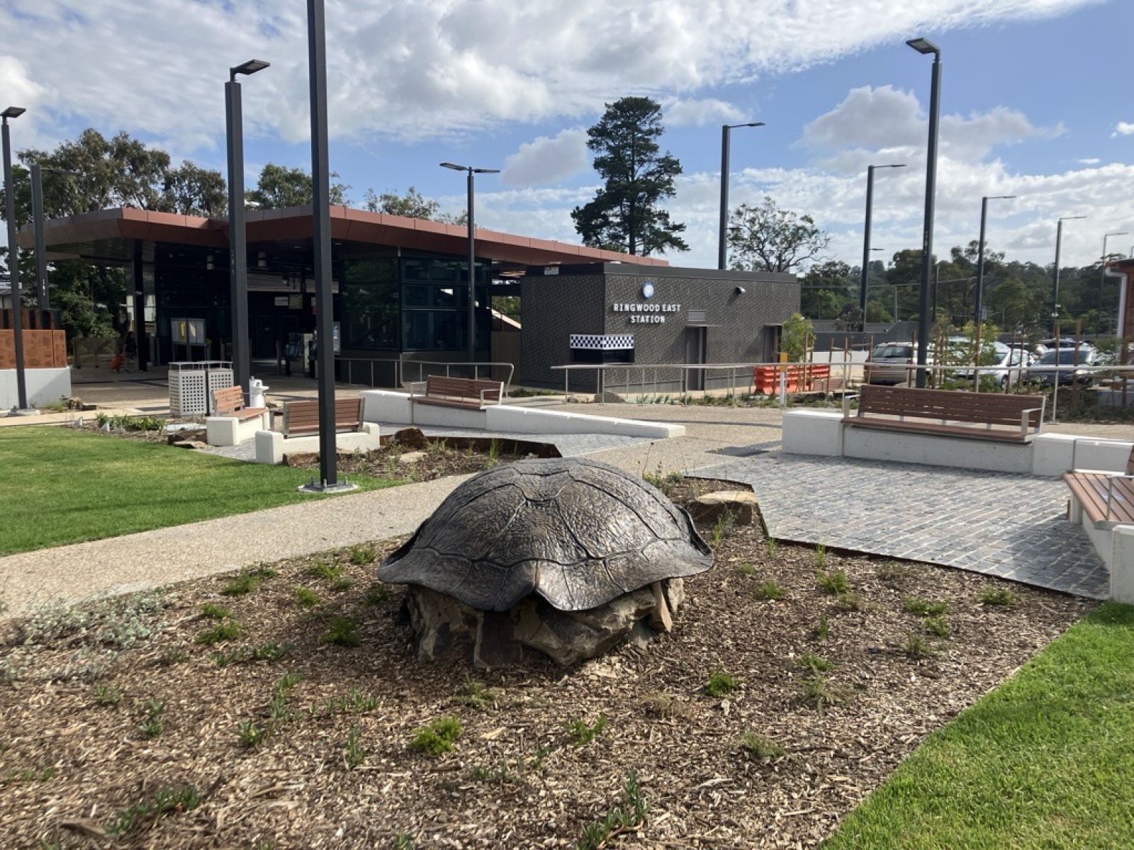 Turtle Guardian, a large turle shell situated on a rock, in the Ringwood East Station forcourt