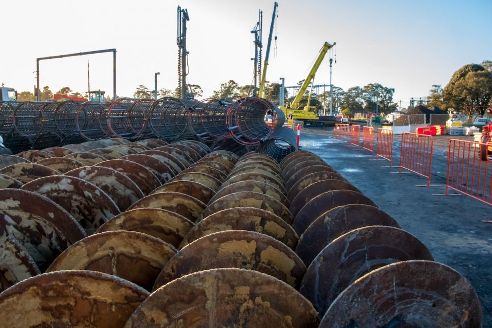 Pile cages and auger heads