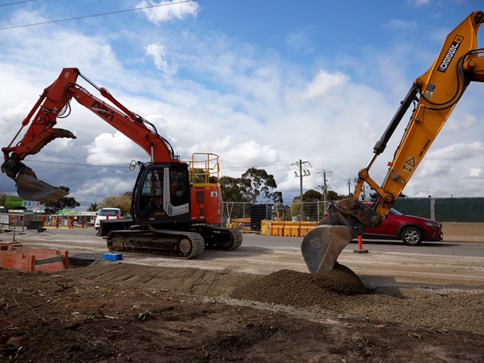 Image displays two excavators moving earth onsite