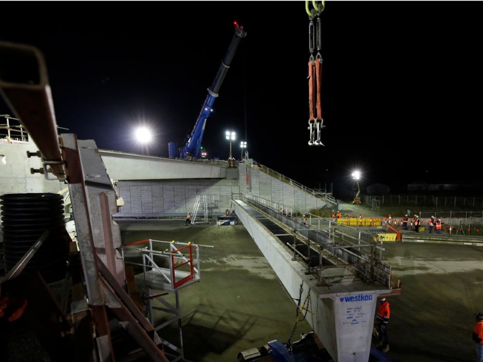 Lifting the beams into place for the bridge over Centre Dandenong Road.