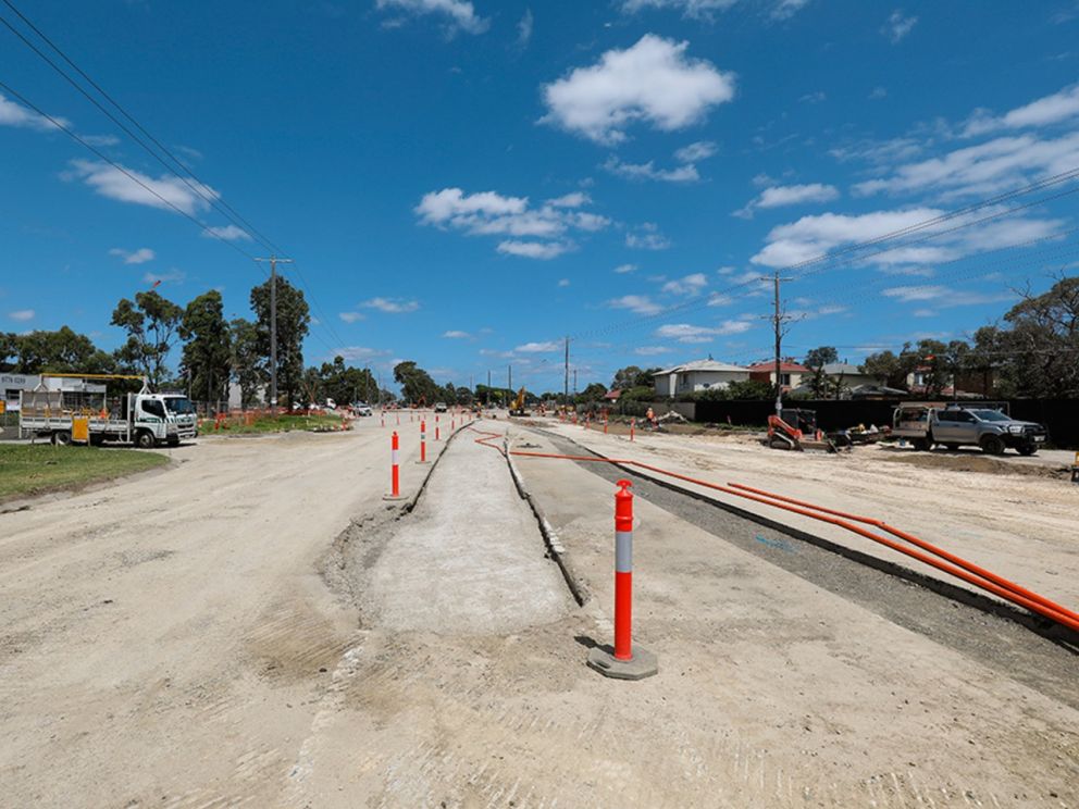 Looking south as works continue to build the new intersection at Wells Road and Thames Promenade with the road cleared for works