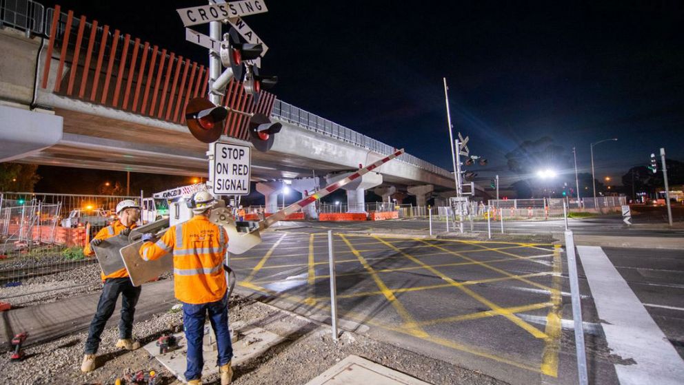 Workers remove the Werribee Street boom gates