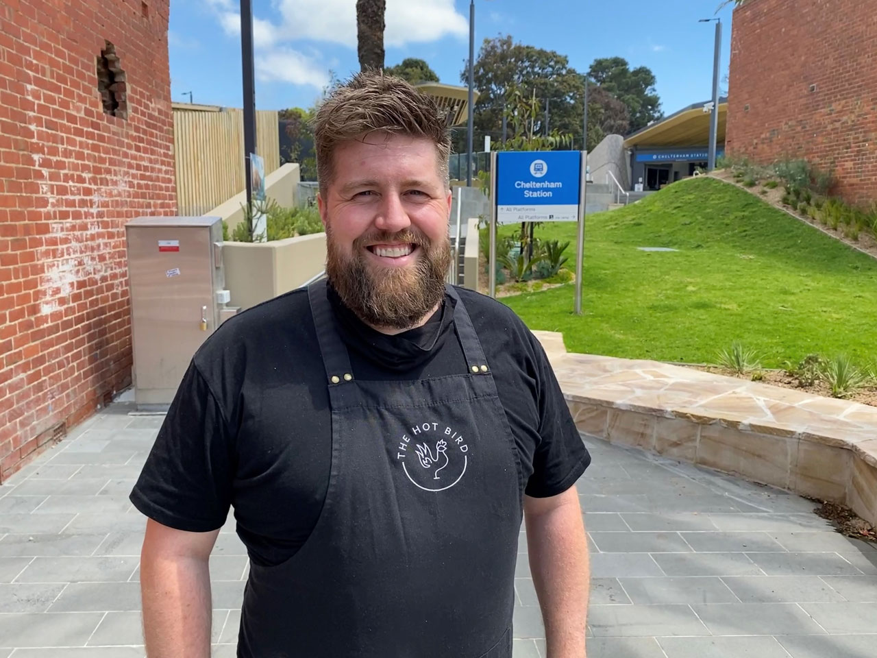 Alan, owner of The Hot Bird in front of the new Cheltenham Station grass.
