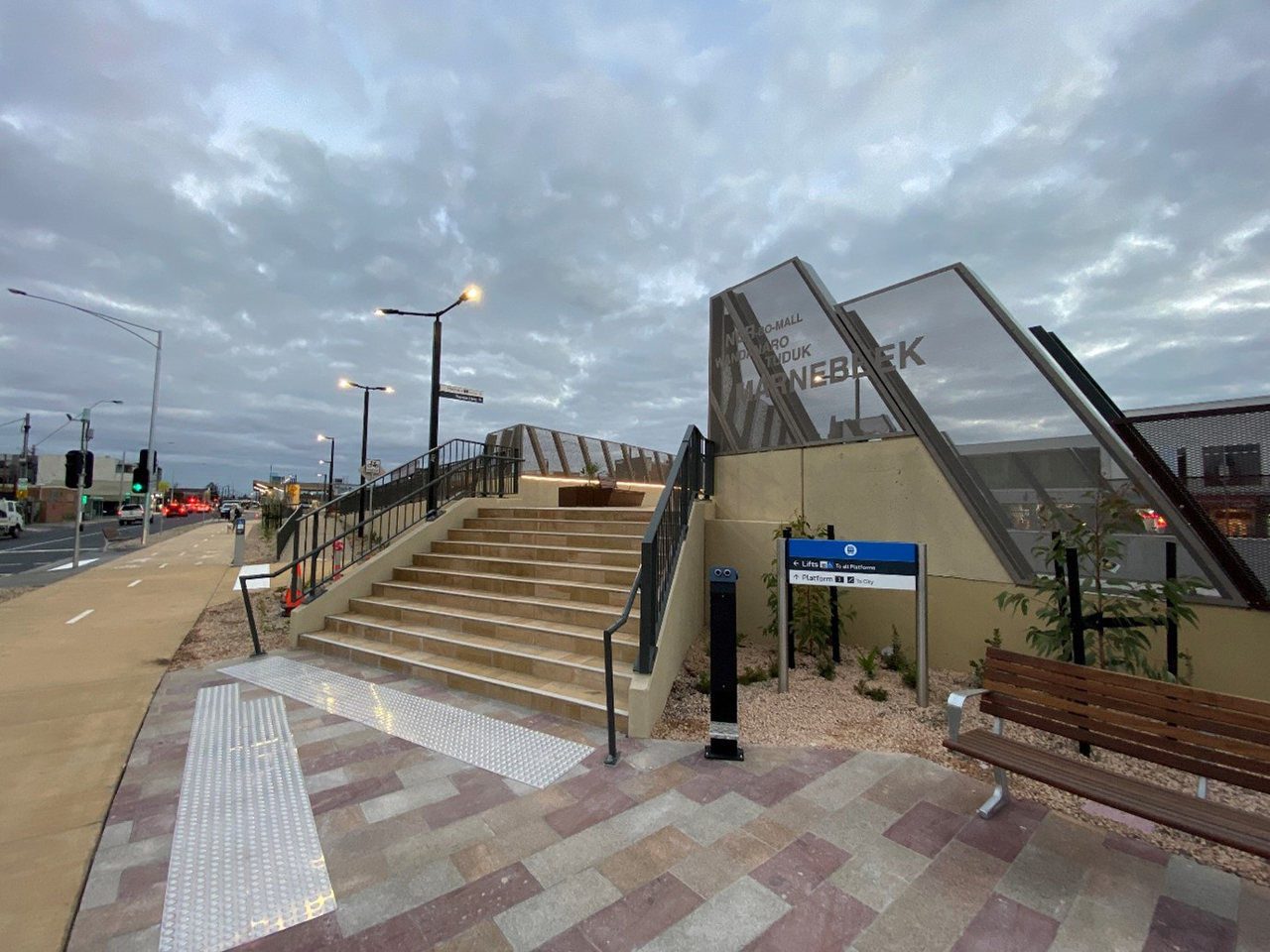 Pedestrian bridge over rail line and footpath.