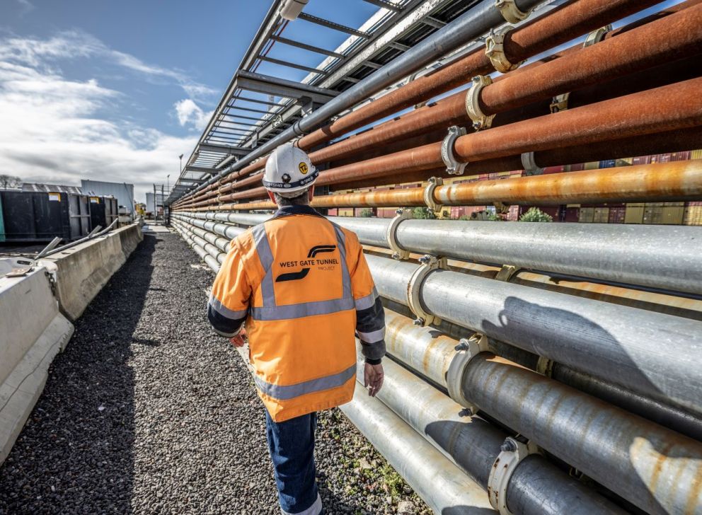 A worker inspects the TBM pipes at the TBM tunnelling compound.