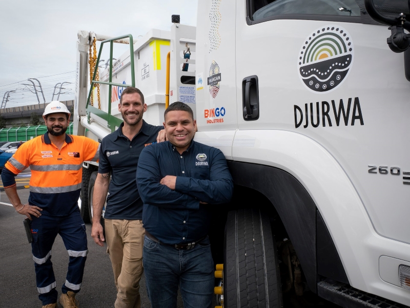 Workers from Djurwa stand in front of the waste disposal truck