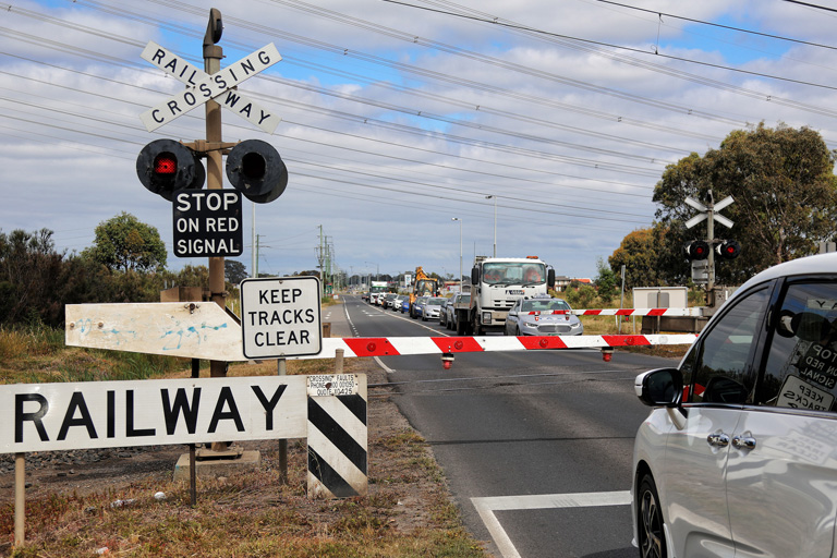 Traffic waiting at Thompsons Road level crossing