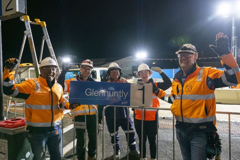 Crews with the Glenhuntly Station sign