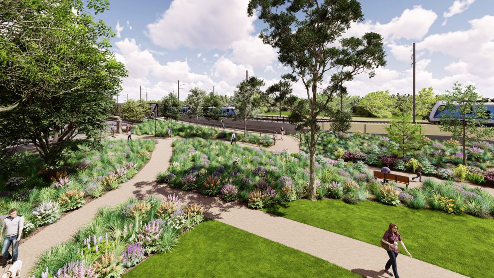 wide view render of people on footpath and in parkland alongside elevated rail bridge with trains running along in both directions, separated by flowerbed embankment