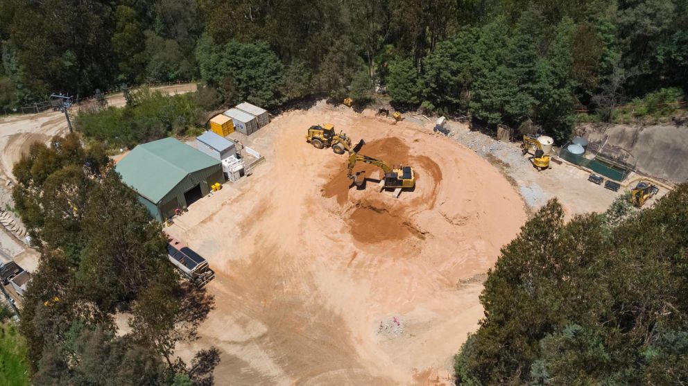 Machines work near the AGL shed located next to the landslip site