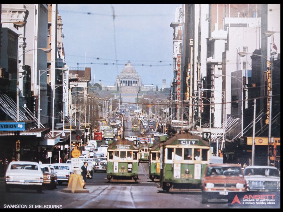 Trams and traffic travelling down Swanston street in 1971