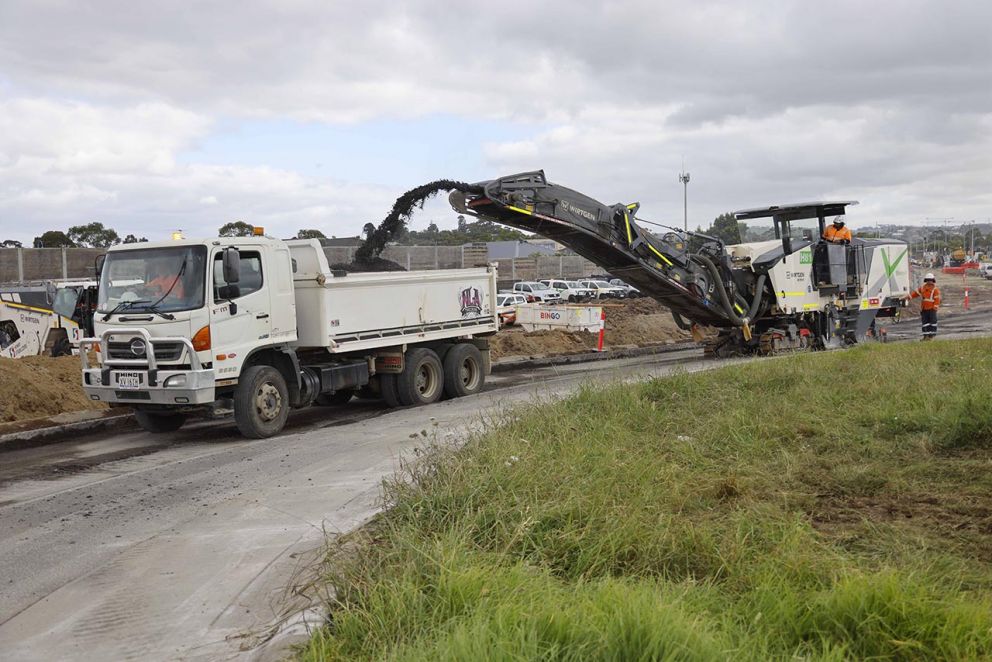 Existing asphalt being removed by a profiler.