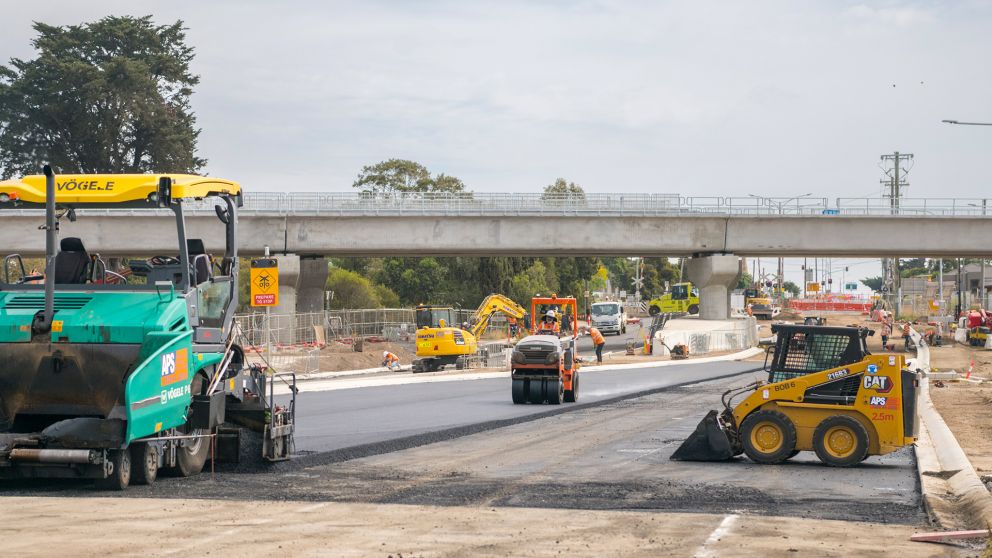 Machinery asphalting the road on Surf Coast Highway