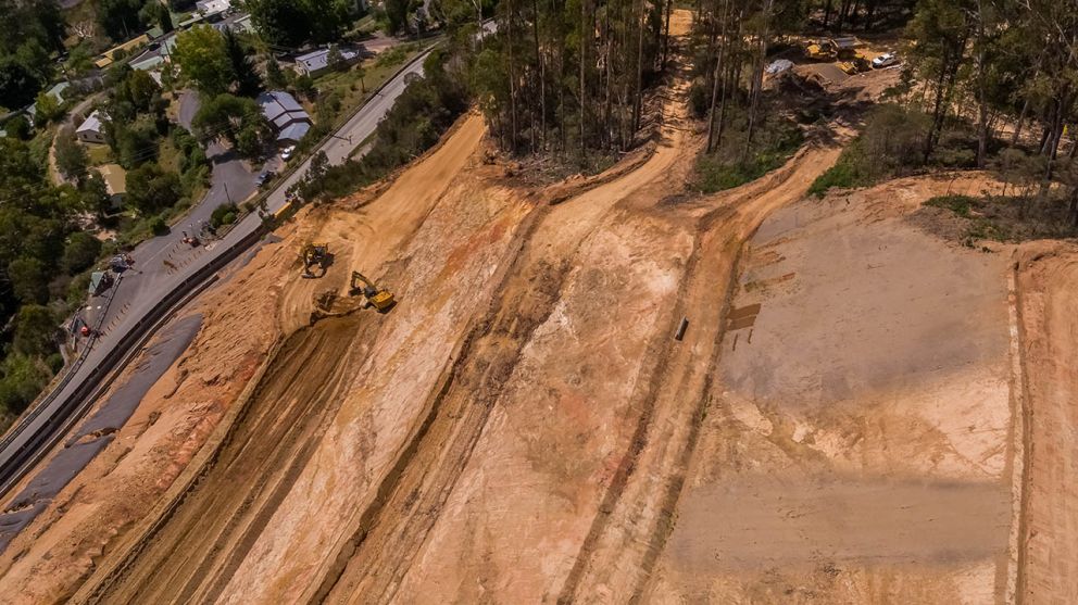 Aerial view of the landslip showing benches being shaped by construction machinery