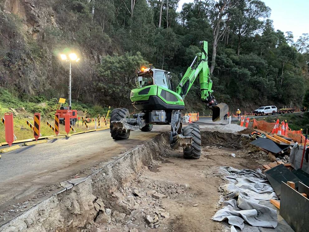 The 17 tonne spider excavator uses its independent legs to balance on an uneven surface at the second smaller landslip