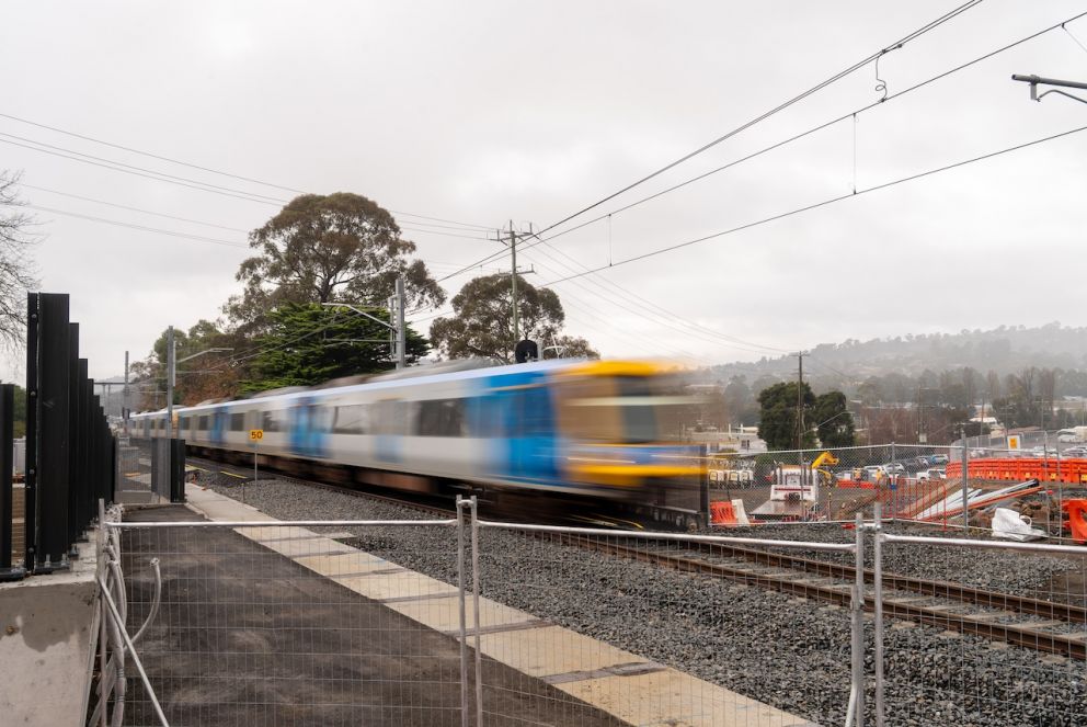 Train traveling over the Cave Hill Road underpass