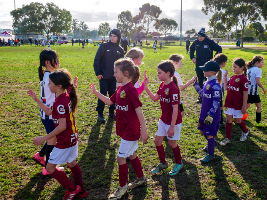 Soccer kids giving high fives