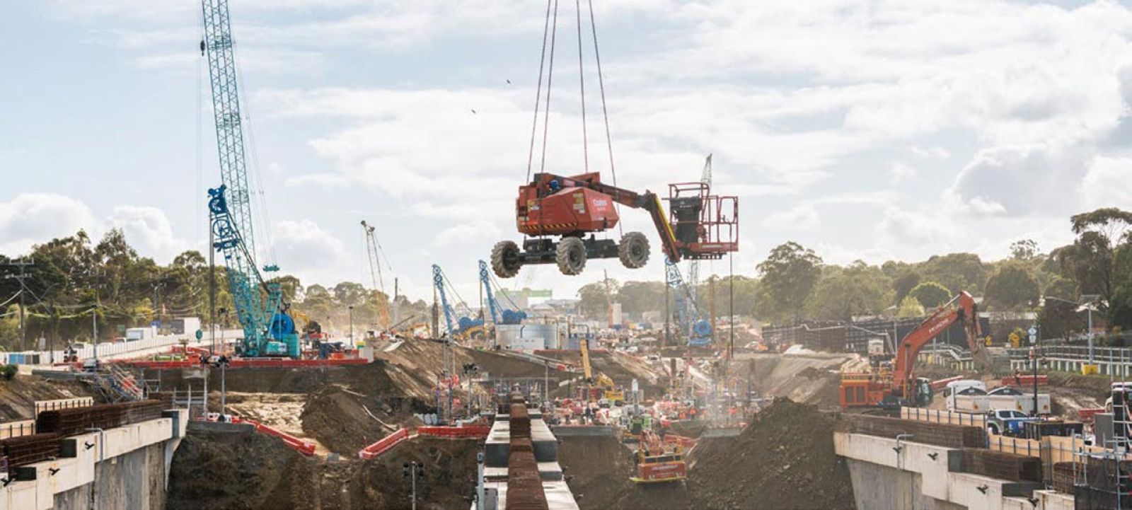 Machinery being lowered into the Lower Plenty Road interchange tunnel area to continue excavation work