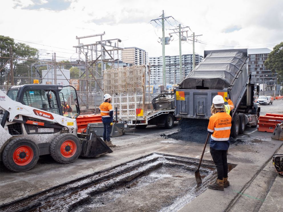 Tarmac being poured at Glen Waverley as site works continue.