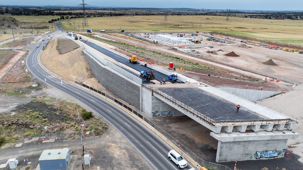 Asphalt works on the approach to the new Calder Park Drive road bridge