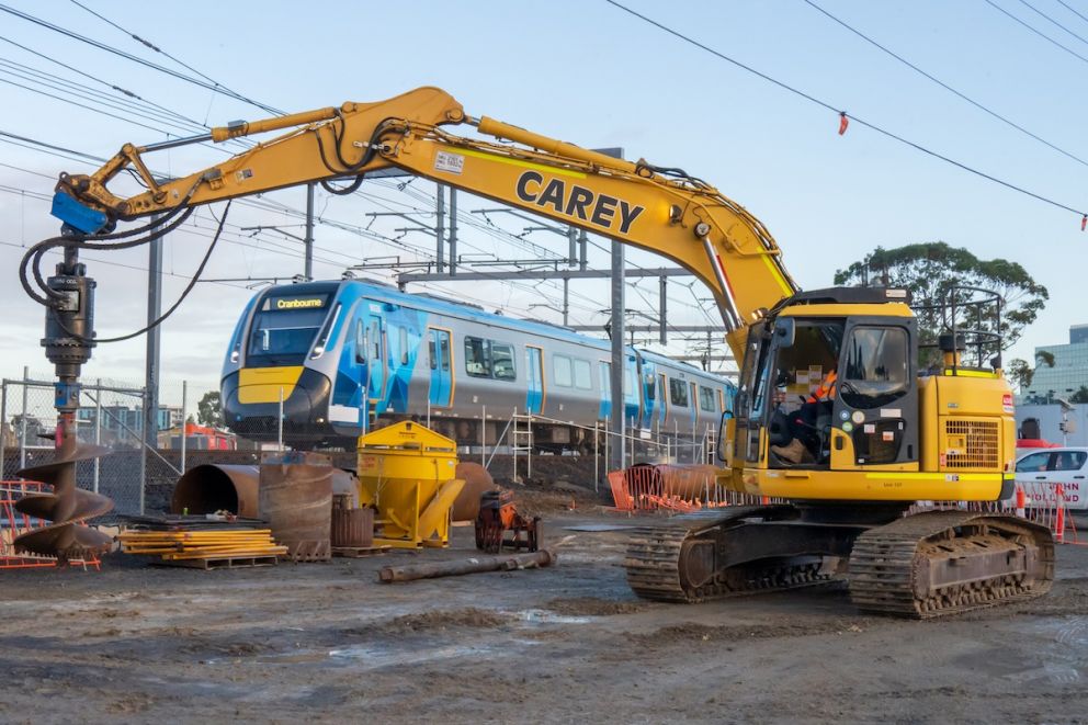Cranbourne Line service rolls past as our crews complete piling works