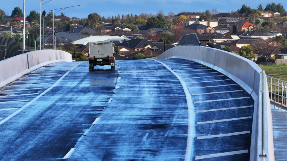 Cars travel across the new Calder Park Drive road bridge