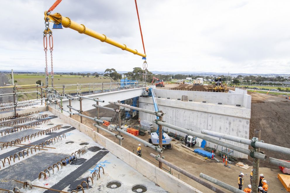 Nine concrete beams were lifted into place at Hopkins Road, completing the last span of the new bridge