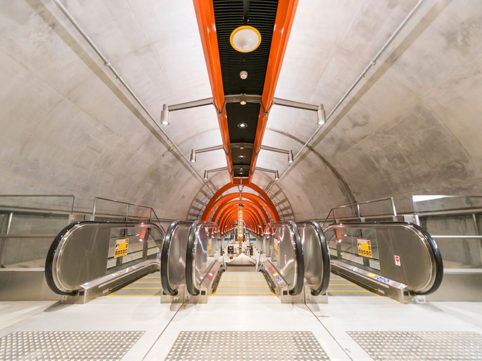 Escalators going down to the platform at Town Hall Station. 