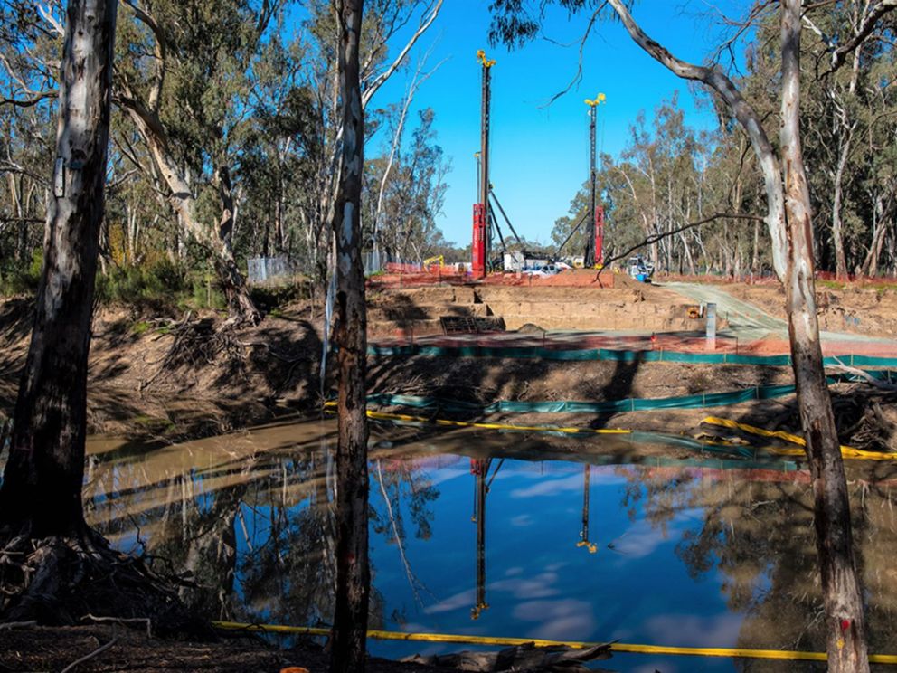 Image of the Campaspe River and its construction in the background