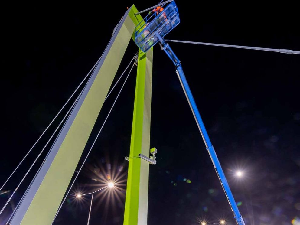 The Blaxland Avenue overpass being painted in the colour 'Kikuyu' which was chosen by the local community.