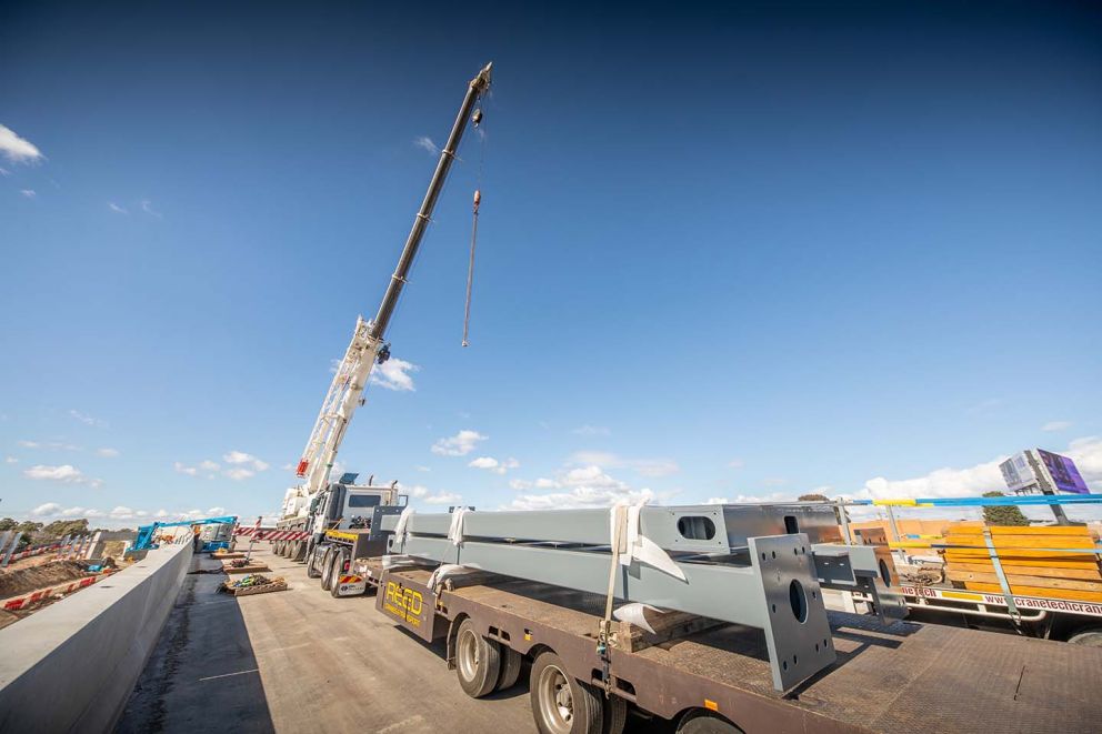 Overhead signage structure supports being delivered