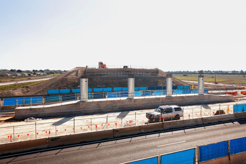 Crews continuing to build the centre support and abutments for the bridge over Springvale Road 