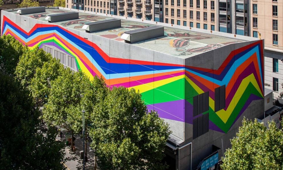 A bright mural on a big shed on Swanston Street