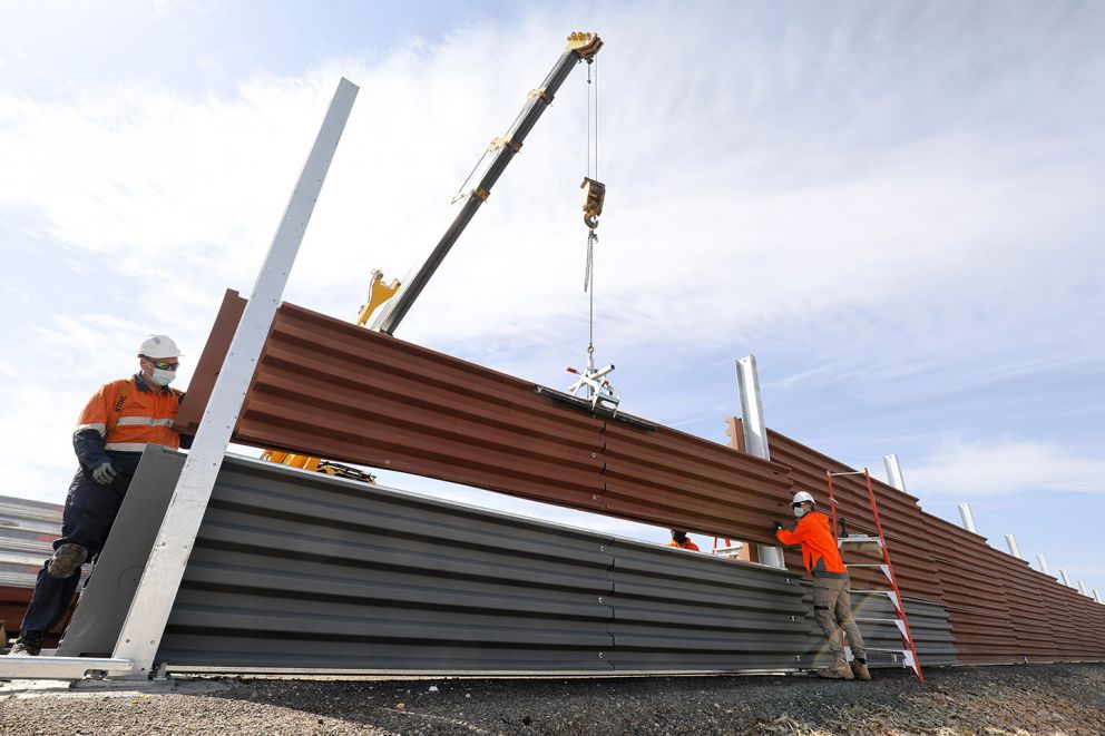 Continuing to install the 75% recycled plastic noise walls along the freeway 