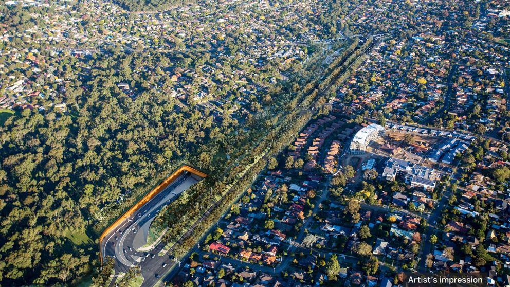 Artist’s impression aerial view looking south along the new Greensborough Road boulevard, Borlase Reserve parklands and Lower Plenty Road interchange, Yallambie. The ramps in and out of the tunnel are for trips to and from the Eastern Freeway on North East Link. 