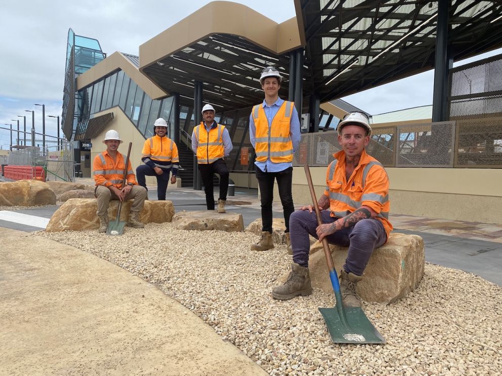 Wiradjuri man Hayden Heta and workers from Wamarra outside the new Chelsea Station.
