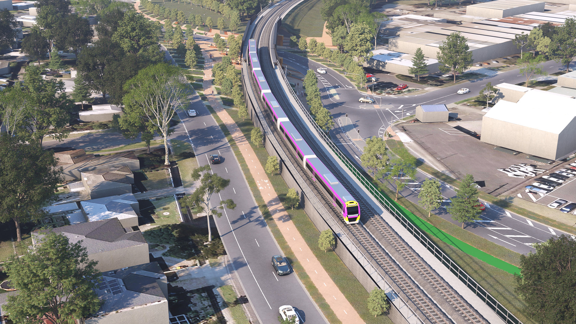 Fyans Street render from an aerial perspective from Carr Street. This image depicts the rail line with a V/Line Train travelling on it in the middle of the image. The shared user path with pedestrians in featured in the middle and on the left-hand side of the image is Carr Street, featuring a car travelling down Carr Street. 