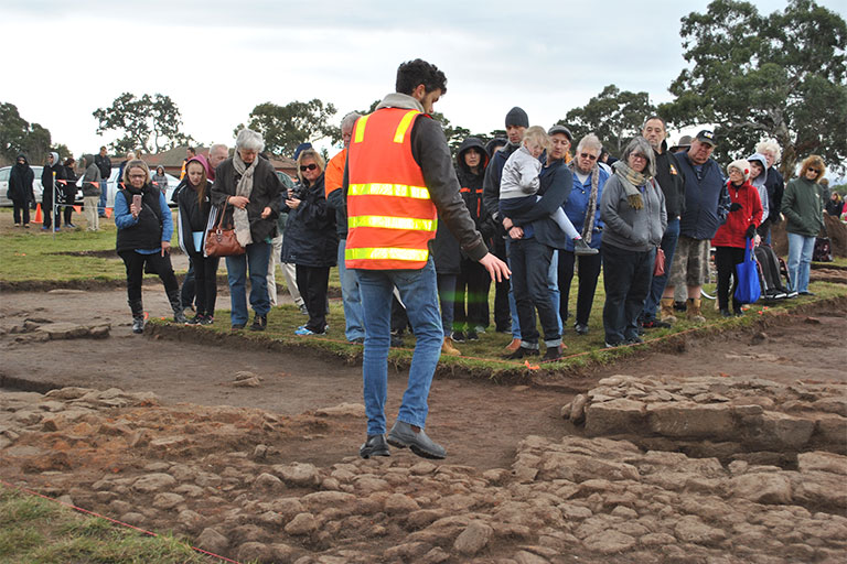 People gather around Mernda digging site