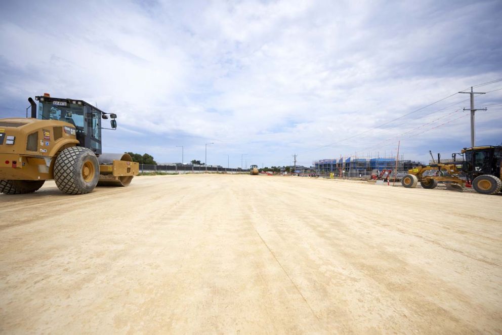Compacting Hall Road to place materials 
