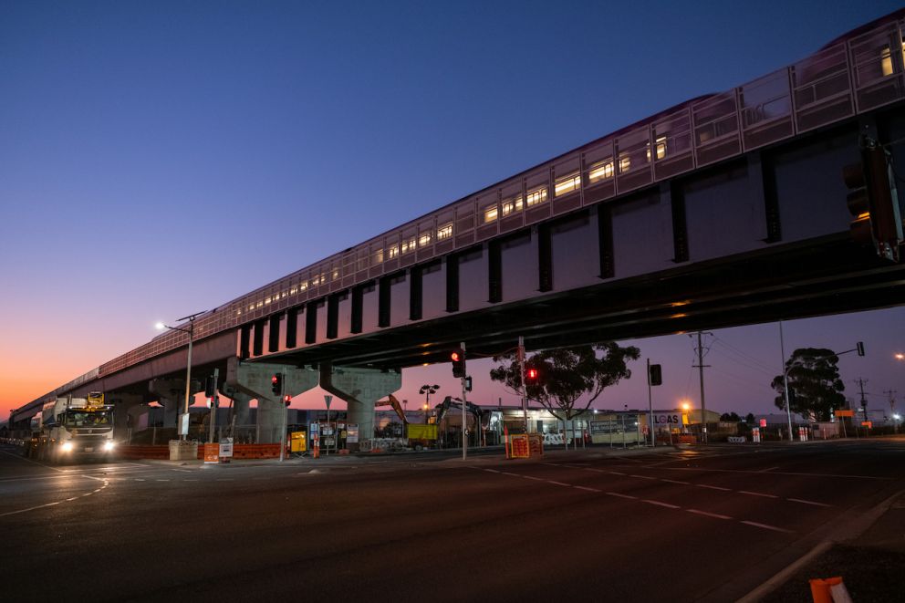 Train going over the elevated rail at Mt Derrimut Road