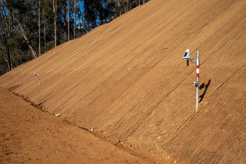 Side view of one of the Bogong High Plains Rd landslip benches with a tilt sensor in the foreground