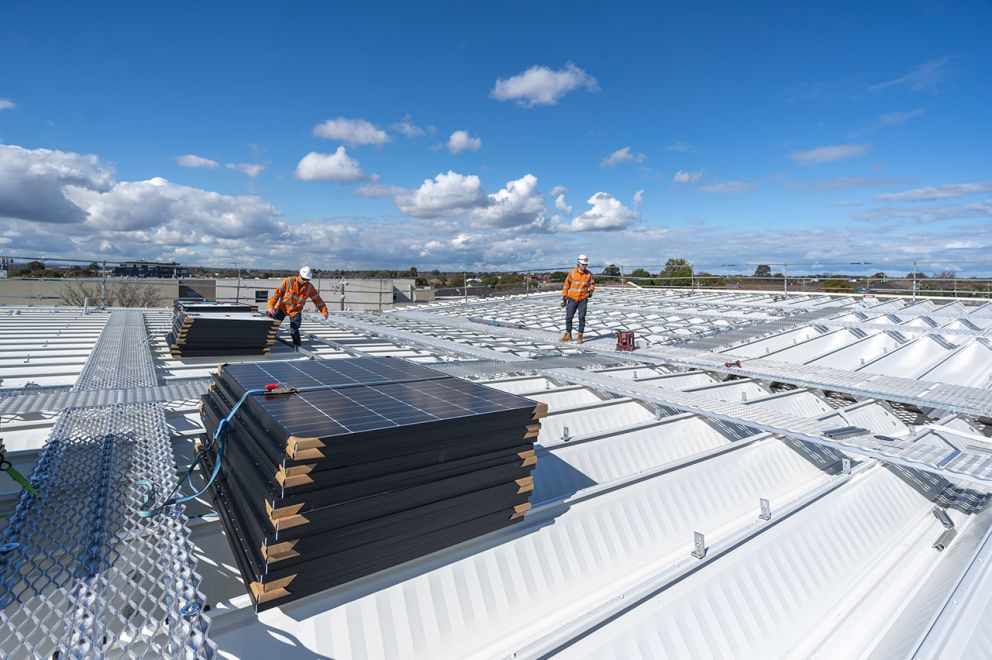 Laying solar panels at the new Glen Huntly Station