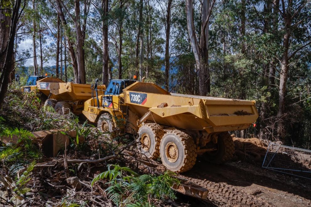 Dump truck moving material from the landslip