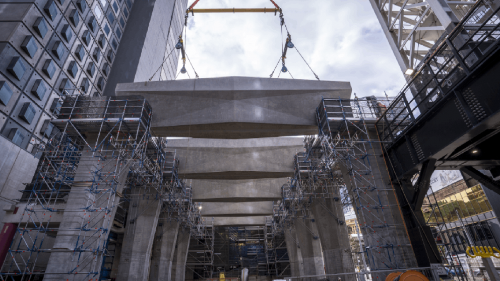 A beam is lifted into place to form State Library Station's future entrance