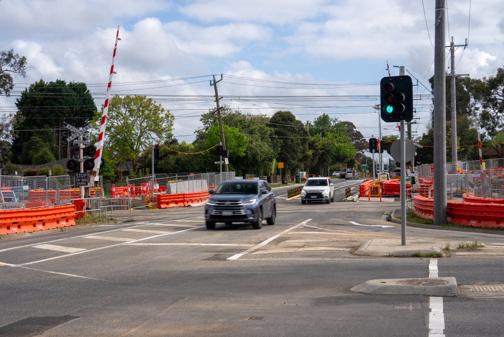 Cars driving through the reopened Dublin Road level crossing
